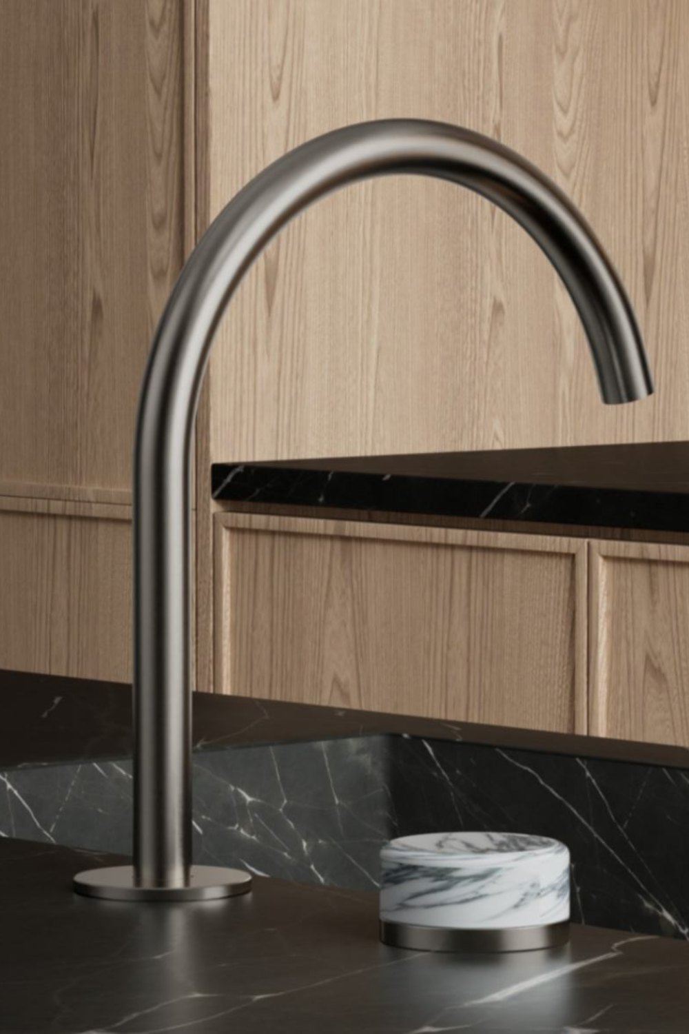 Gunmetal kitchen mixer over a black marble benchtop